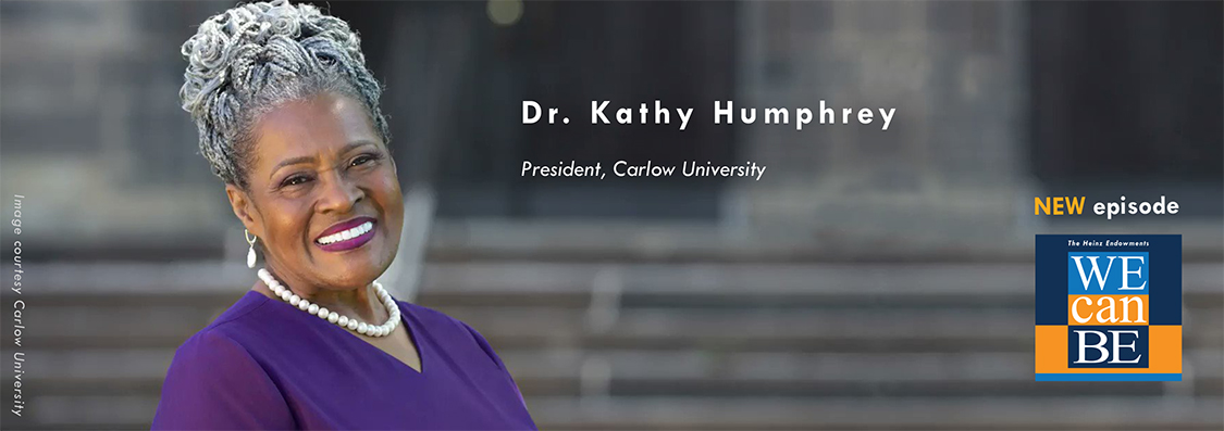 Dr. Kathy Humphrey in a purple dress, smiling.